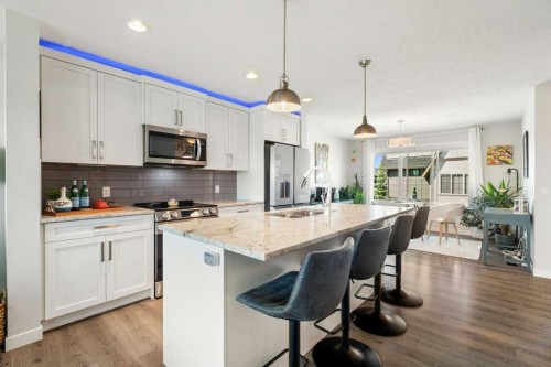 2202-250 Fireside View, Cochrane, AB - Indoor Photo Showing Kitchen With Stainless Steel Kitchen With Upgraded Kitchen