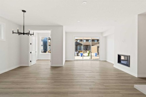 152 Creekstone Circle Sw, Calgary, AB - Indoor Photo Showing Living Room With Fireplace