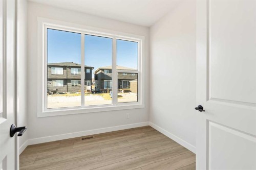 152 Creekstone Circle Sw, Calgary, AB - Indoor Photo Showing Other Room