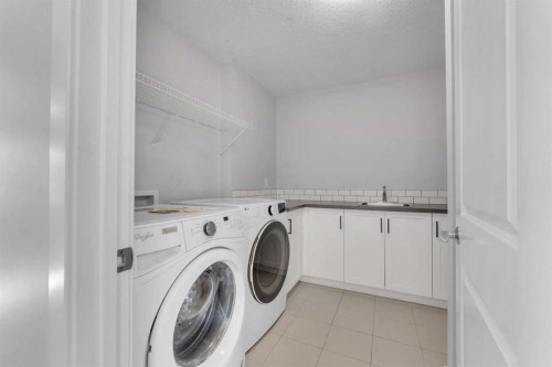 34 Sage Bluff Heights Nw, Calgary, AB - Indoor Photo Showing Laundry Room