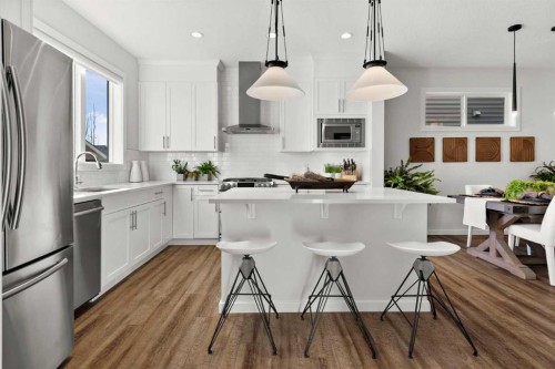 128 Heritage Heights, Cochrane, AB - Indoor Photo Showing Kitchen With Stainless Steel Kitchen With Upgraded Kitchen