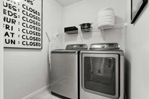 128 Heritage Heights, Cochrane, AB - Indoor Photo Showing Laundry Room