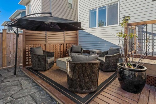 128 Heritage Heights, Cochrane, AB - Outdoor With Deck Patio Veranda With Exterior