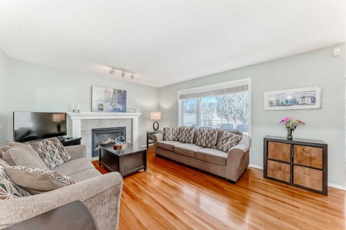 6 Mt Yamnuska Court Se, Calgary, AB - Indoor Photo Showing Living Room With Fireplace