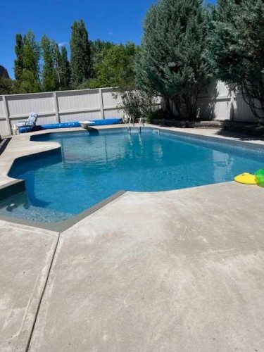 6 Mt Yamnuska Court Se, Calgary, AB - Outdoor With In Ground Pool