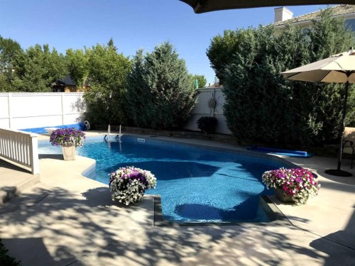 6 Mt Yamnuska Court Se, Calgary, AB - Outdoor With In Ground Pool With Backyard