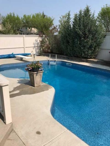 6 Mt Yamnuska Court Se, Calgary, AB - Outdoor With In Ground Pool