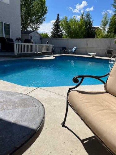 6 Mt Yamnuska Court Se, Calgary, AB - Outdoor With In Ground Pool With Backyard