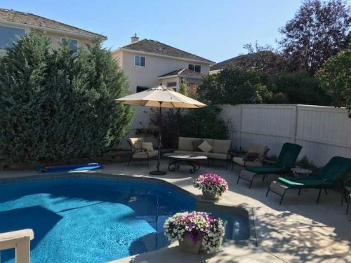 6 Mt Yamnuska Court Se, Calgary, AB - Outdoor With In Ground Pool With Deck Patio Veranda With Backyard