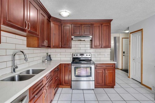 40 Temple Place Ne, Calgary, AB - Indoor Photo Showing Kitchen With Stainless Steel Kitchen With Double Sink