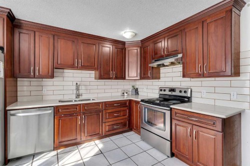 40 Temple Place Ne, Calgary, AB - Indoor Photo Showing Kitchen With Stainless Steel Kitchen With Double Sink