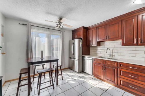 40 Temple Place Ne, Calgary, AB - Indoor Photo Showing Kitchen With Stainless Steel Kitchen With Double Sink