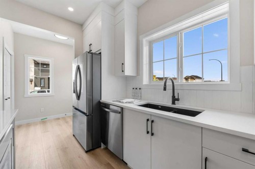 68 Buffaloberry Manor Se, Calgary, AB - Indoor Photo Showing Kitchen With Double Sink With Upgraded Kitchen