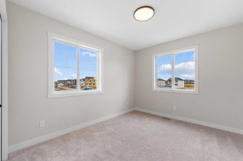 68 Buffaloberry Manor Se, Calgary, AB - Indoor Photo Showing Other Room