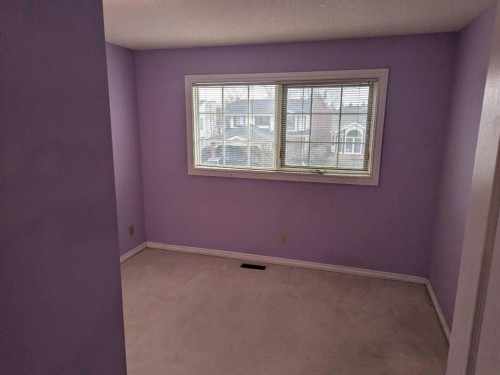 165 Woodford Drive Sw, Calgary, AB - Indoor Photo Showing Other Room