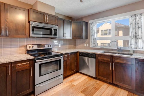 336 Covecreek Circle Ne, Calgary, AB - Indoor Photo Showing Kitchen With Stainless Steel Kitchen With Double Sink