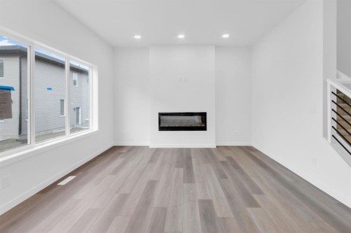 449 Savanna Landing Ne, Calgary, AB - Indoor Photo Showing Living Room With Fireplace