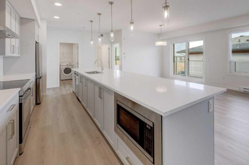 2315-550 Belmont Street Sw, Calgary, AB - Indoor Photo Showing Kitchen With Upgraded Kitchen