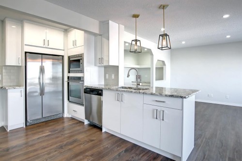 25 Panamount Crescent Nw, Calgary, AB - Indoor Photo Showing Kitchen With Stainless Steel Kitchen With Upgraded Kitchen