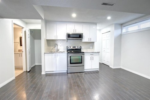 25 Panamount Crescent Nw, Calgary, AB - Indoor Photo Showing Kitchen With Stainless Steel Kitchen
