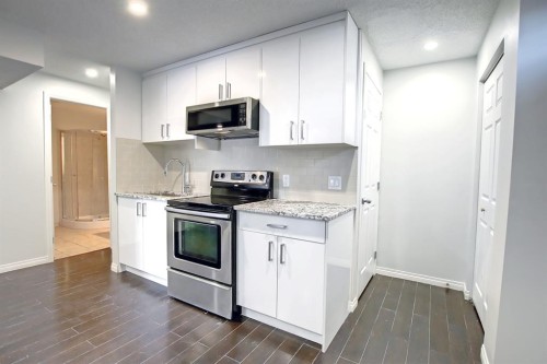 25 Panamount Crescent Nw, Calgary, AB - Indoor Photo Showing Kitchen With Stainless Steel Kitchen With Upgraded Kitchen