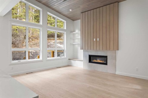 249B Three Sisters Drive, Canmore, AB - Indoor Photo Showing Other Room With Fireplace