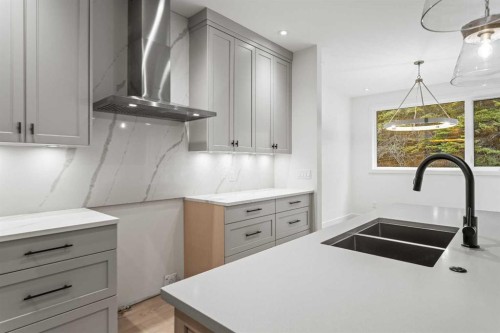 249B Three Sisters Drive, Canmore, AB - Indoor Photo Showing Kitchen With Double Sink