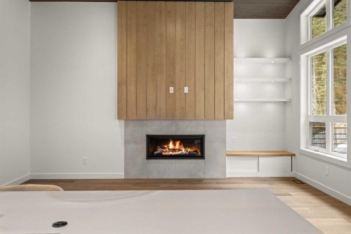 249A Three Sisters Drive, Canmore, AB - Indoor Photo Showing Living Room With Fireplace