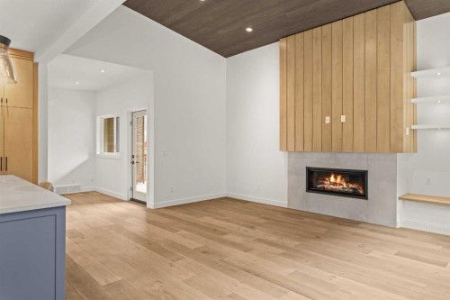 249A Three Sisters Drive, Canmore, AB - Indoor Photo Showing Other Room With Fireplace