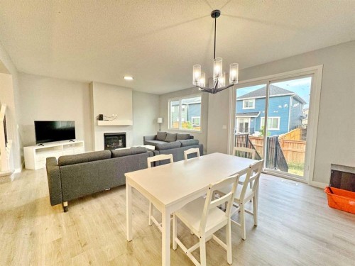 14 Sundown Close, Cochrane, AB - Indoor With Fireplace