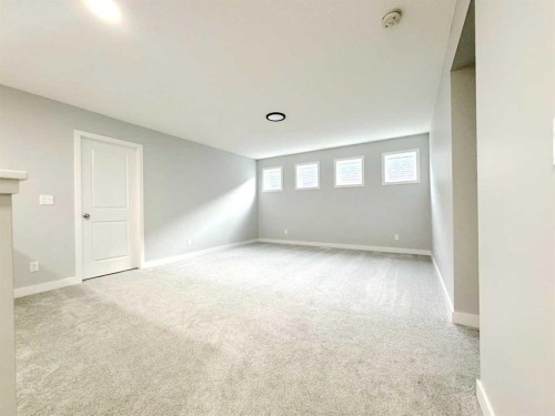 14 Sundown Close, Cochrane, AB - Indoor Photo Showing Other Room