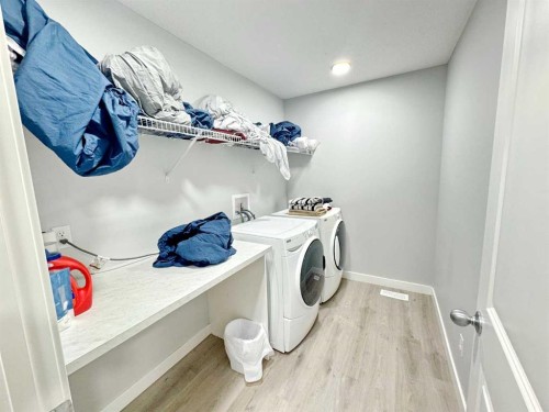 14 Sundown Close, Cochrane, AB - Indoor Photo Showing Laundry Room