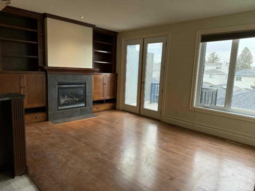 2012 37 Avenue Sw, Calgary, AB - Indoor Photo Showing Living Room With Fireplace