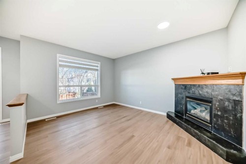 234 Millview Gardens Sw, Calgary, AB - Indoor Photo Showing Other Room With Fireplace