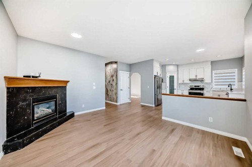 234 Millview Gardens Sw, Calgary, AB - Indoor Photo Showing Living Room With Fireplace