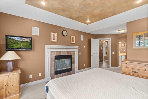 938 Panorama Hills Drive Nw, Calgary, AB - Indoor Photo Showing Bedroom With Fireplace