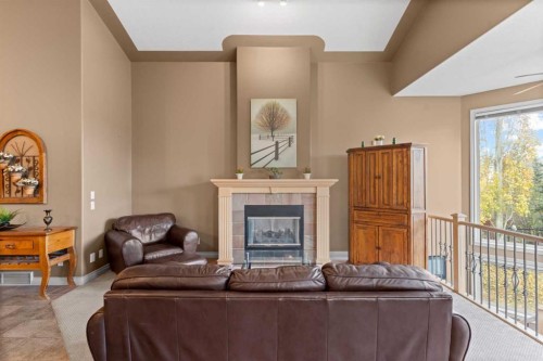 938 Panorama Hills Drive Nw, Calgary, AB - Indoor Photo Showing Living Room With Fireplace