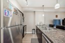 301-117 Copperpond Se, Calgary, AB  - Indoor Photo Showing Kitchen With Stainless Steel Kitchen With Double Sink 