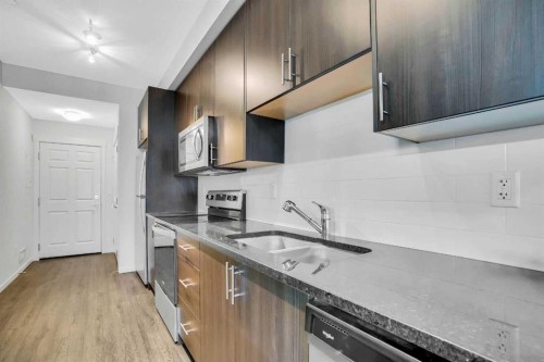 6105-151 Legacy Main Street Se, Calgary, AB - Indoor Photo Showing Kitchen With Double Sink With Upgraded Kitchen
