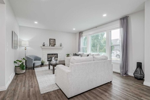 310 Mahogany Manor Se, Calgary, AB - Indoor Photo Showing Living Room With Fireplace