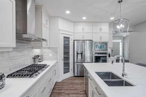 310 Mahogany Manor Se, Calgary, AB - Indoor Photo Showing Kitchen With Stainless Steel Kitchen With Double Sink With Upgraded Kitchen