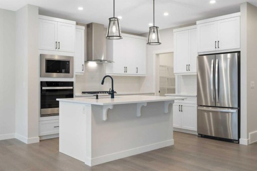 338 Rivercrest Road, Cochrane, AB - Indoor Photo Showing Kitchen With Stainless Steel Kitchen With Upgraded Kitchen