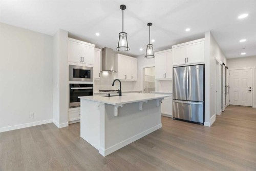 338 Rivercrest Road, Cochrane, AB - Indoor Photo Showing Kitchen With Stainless Steel Kitchen With Upgraded Kitchen