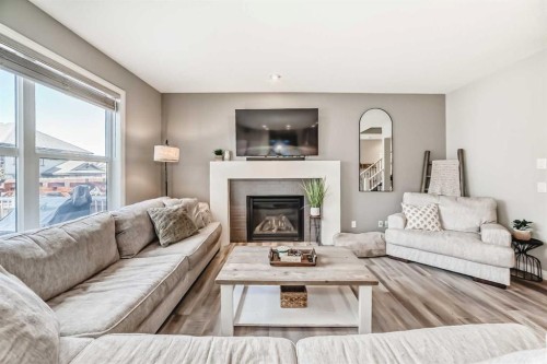 10 Riviera Place, Cochrane, AB - Indoor Photo Showing Living Room With Fireplace