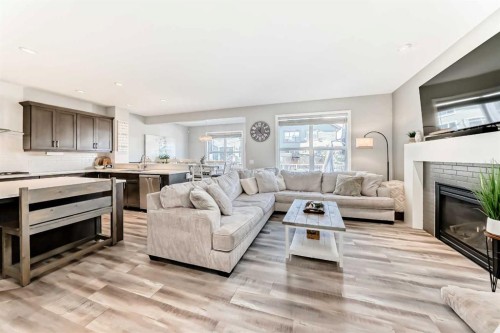 10 Riviera Place, Cochrane, AB - Indoor Photo Showing Living Room With Fireplace