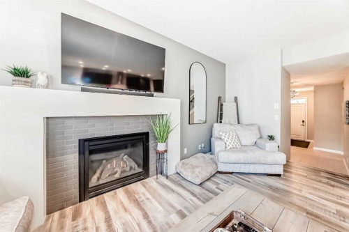 10 Riviera Place, Cochrane, AB - Indoor Photo Showing Living Room With Fireplace
