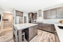 10 Riviera Place, Cochrane, AB  - Indoor Photo Showing Kitchen With Upgraded Kitchen 