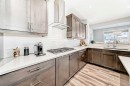 10 Riviera Place, Cochrane, AB  - Indoor Photo Showing Kitchen With Upgraded Kitchen 