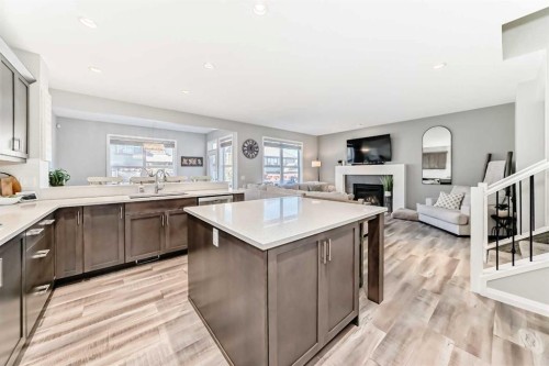 10 Riviera Place, Cochrane, AB - Indoor Photo Showing Kitchen With Fireplace