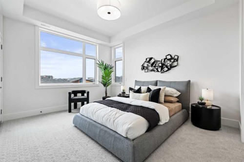 201-130 Marina Cove Se, Calgary, AB - Indoor Photo Showing Bedroom